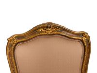 A Set of Four Louis XV Style Painted and Parcel Gilt Dining Chairs