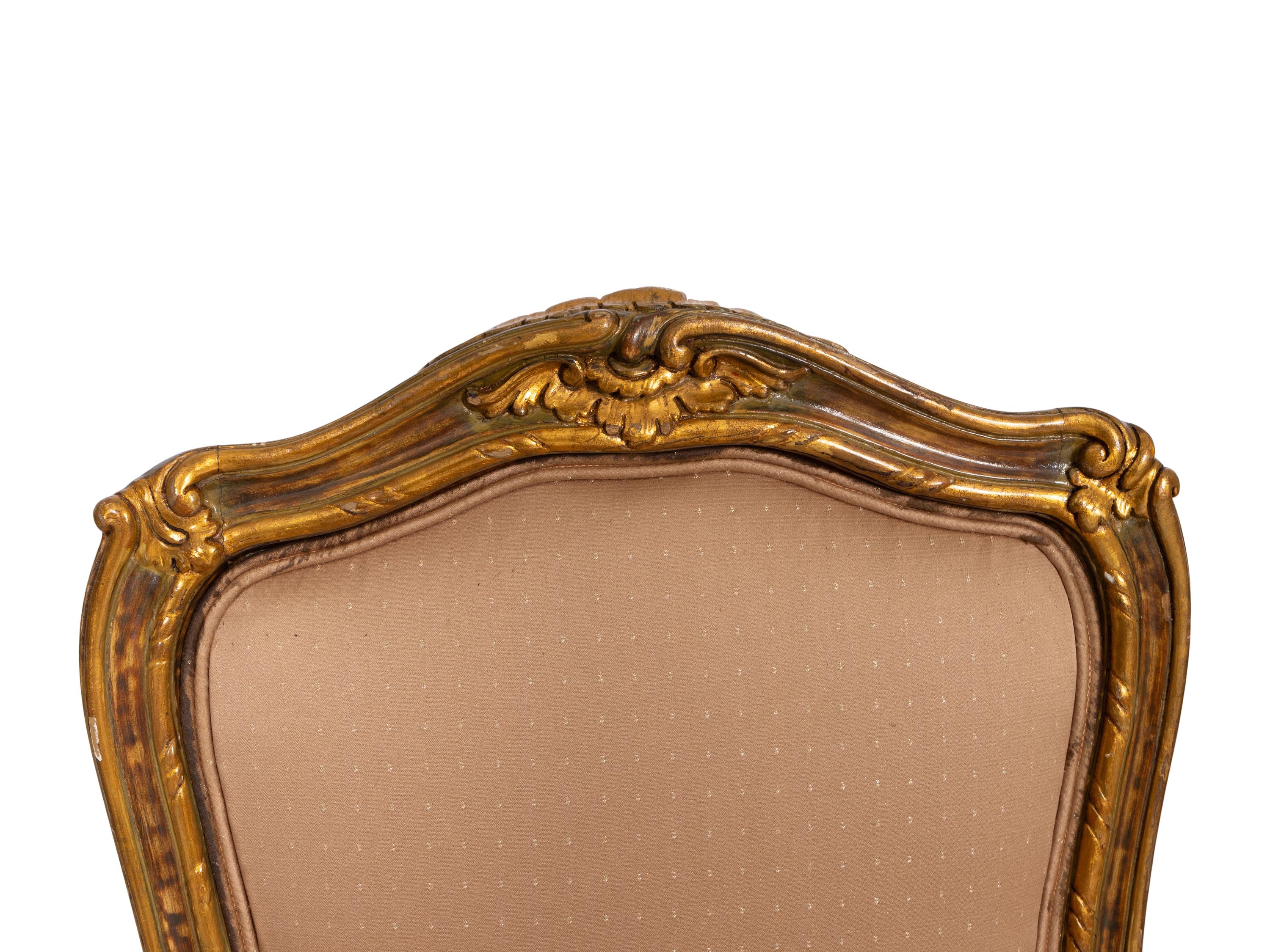 A Set of Four Louis XV Style Painted and Parcel Gilt Dining Chairs
