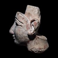An Egyptian Limestone Head from a Composite Statue