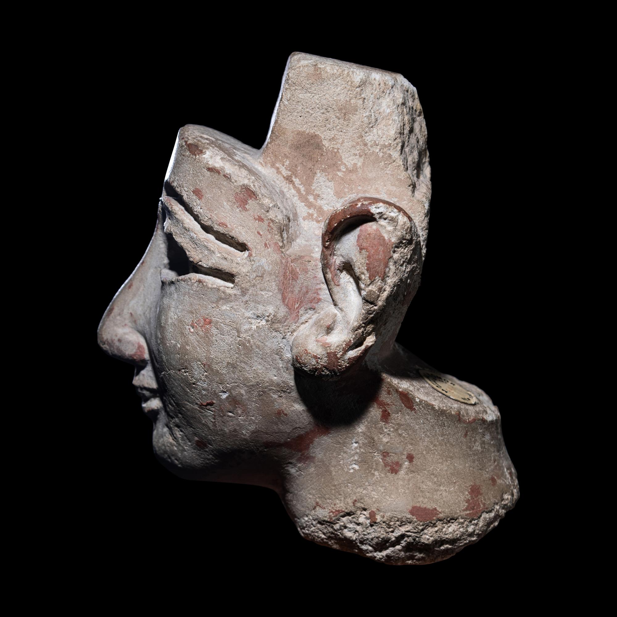 An Egyptian Limestone Head from a Composite Statue