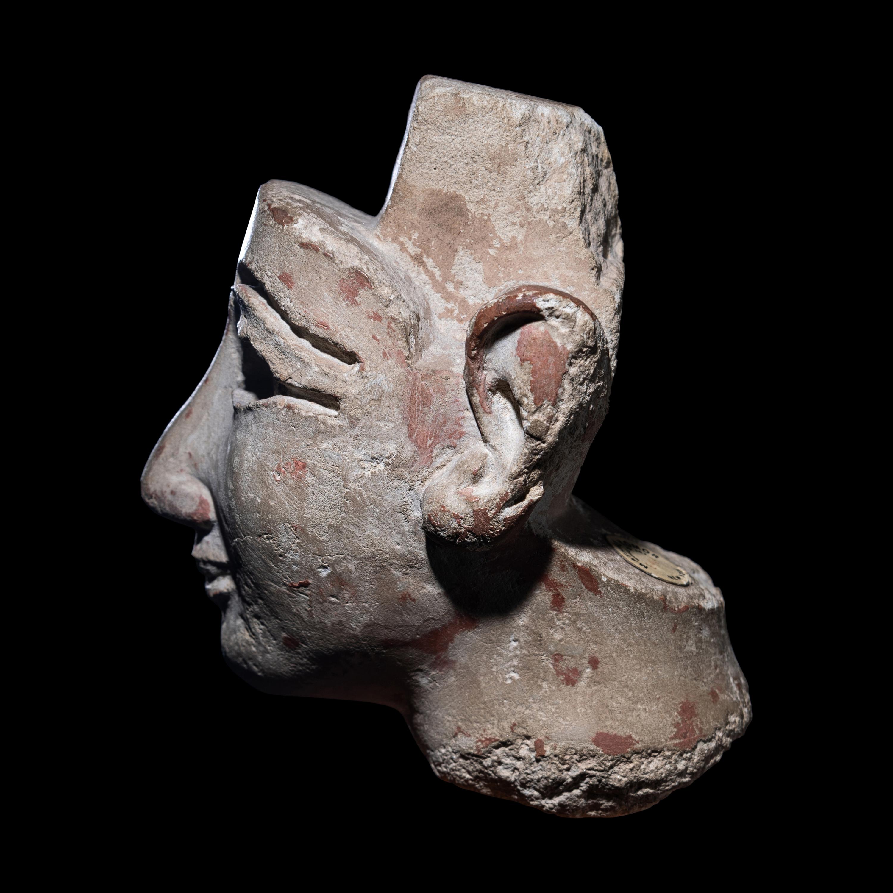 An Egyptian Limestone Head from a Composite Statue