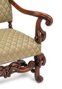 A Continental Baroque Style Carved Walnut Armchair
