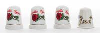 A Group of Four Porcelain Personalized Thimbles Height of first 1 1/8 inches.