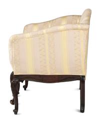 An Italian Carved and Black Painted Walnut Upholstered Sofa