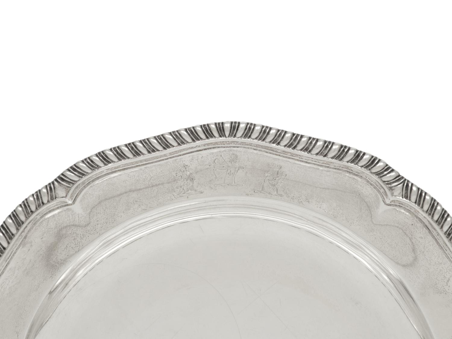 A Set of Twelve George III Silver Dinner Plates