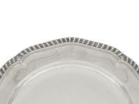 A Set of Twelve George III Silver Dinner Plates