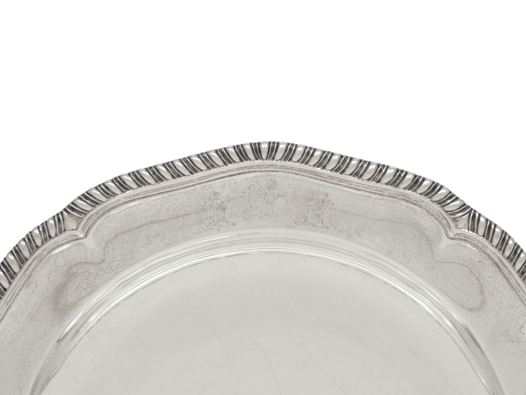 A Set of Twelve George III Silver Dinner Plates