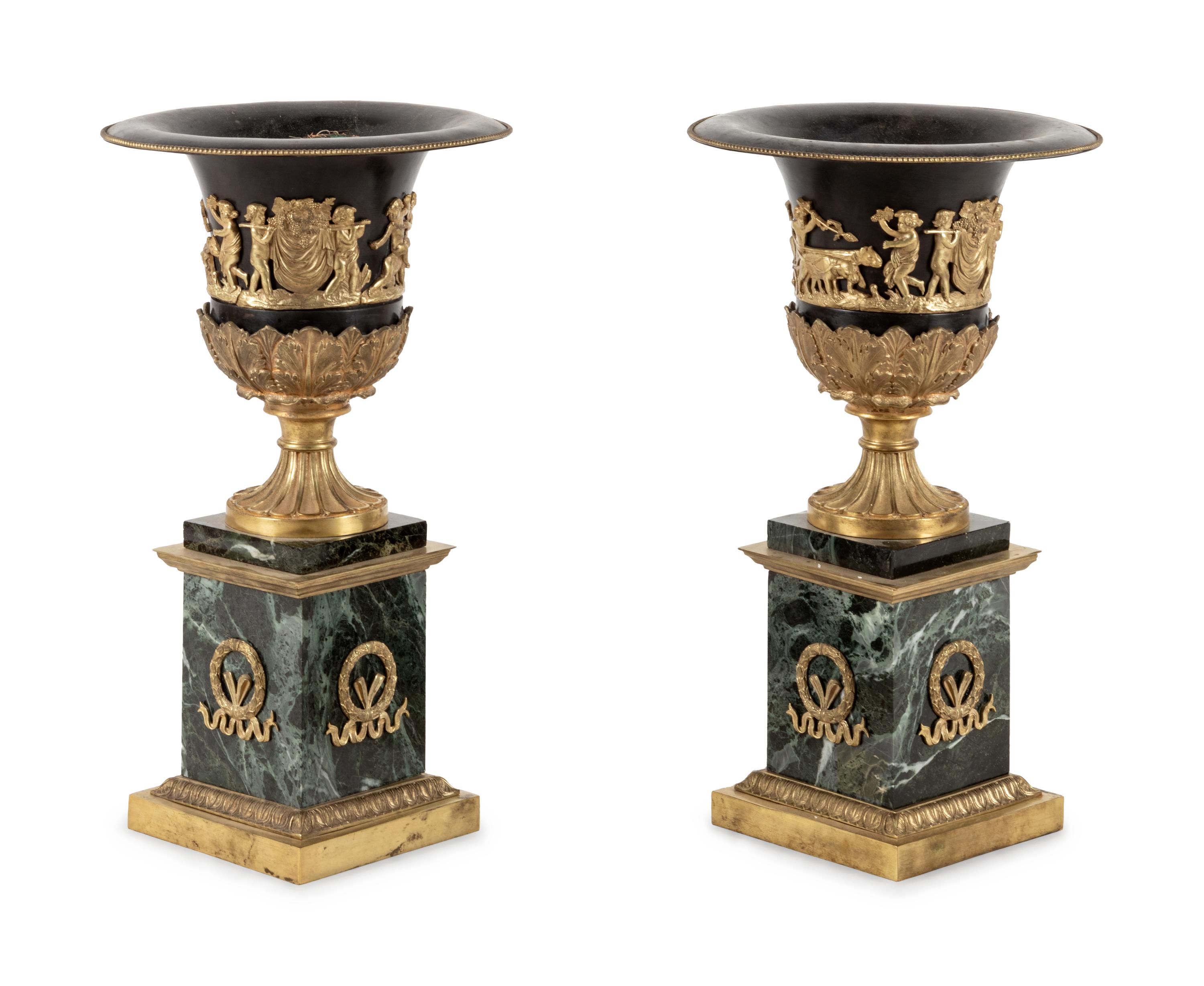 A Pair of Empire Style Gilt Bronze and Tôle Marble Urns