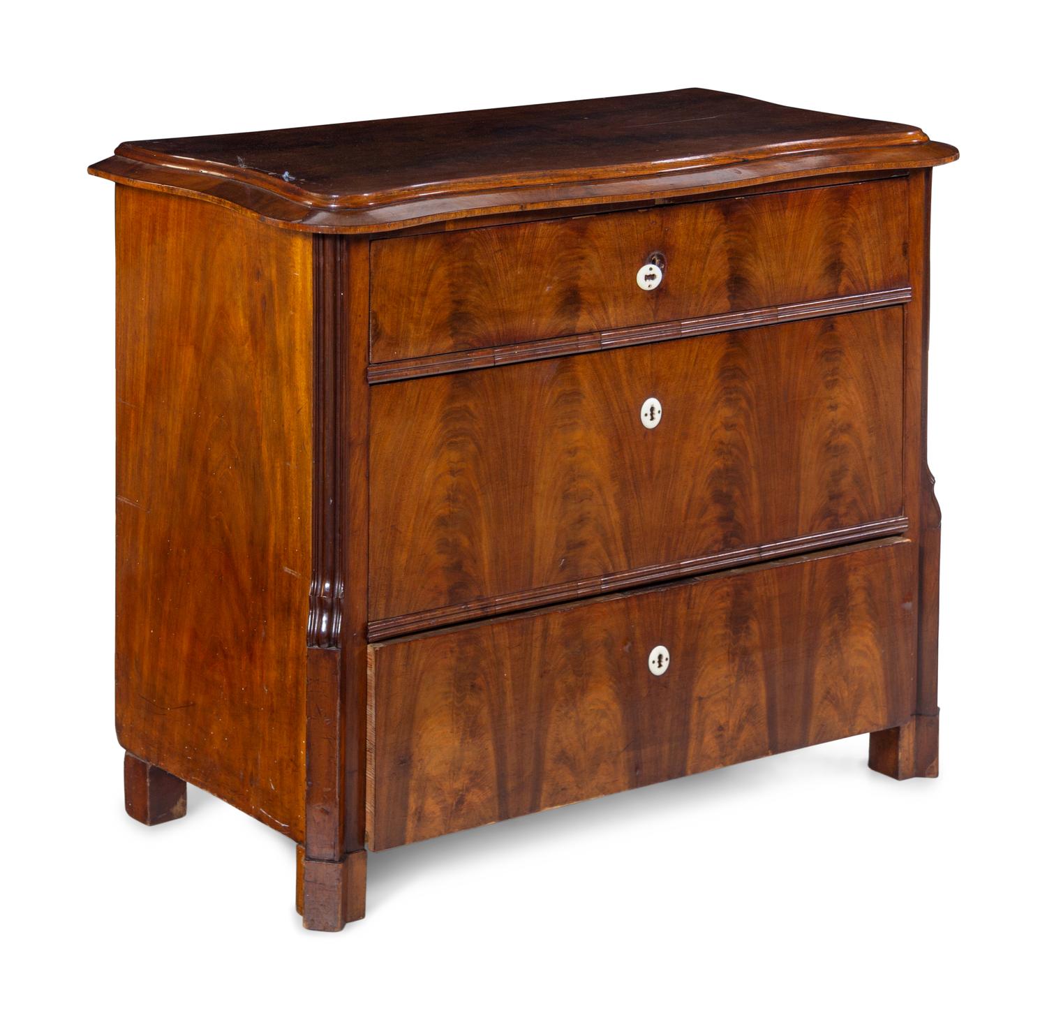 A Continental Mahogany Veneered Chest of Drawers
