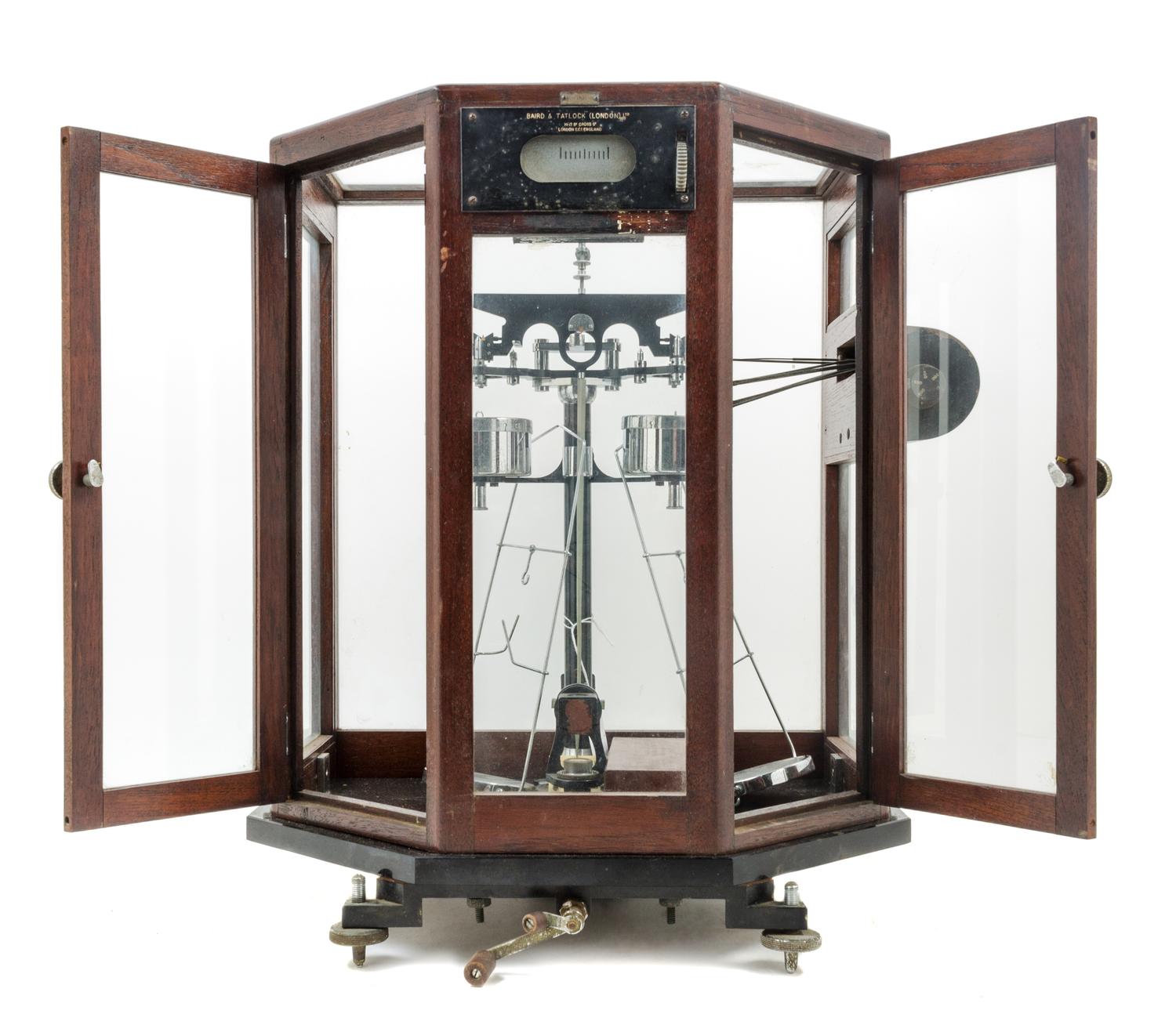 An English Cased Assayer's Balance Height of case 18 x width 16 x depth 11 inches. — BAIRD & TATLOCK, LONDON, 20TH CENTURY