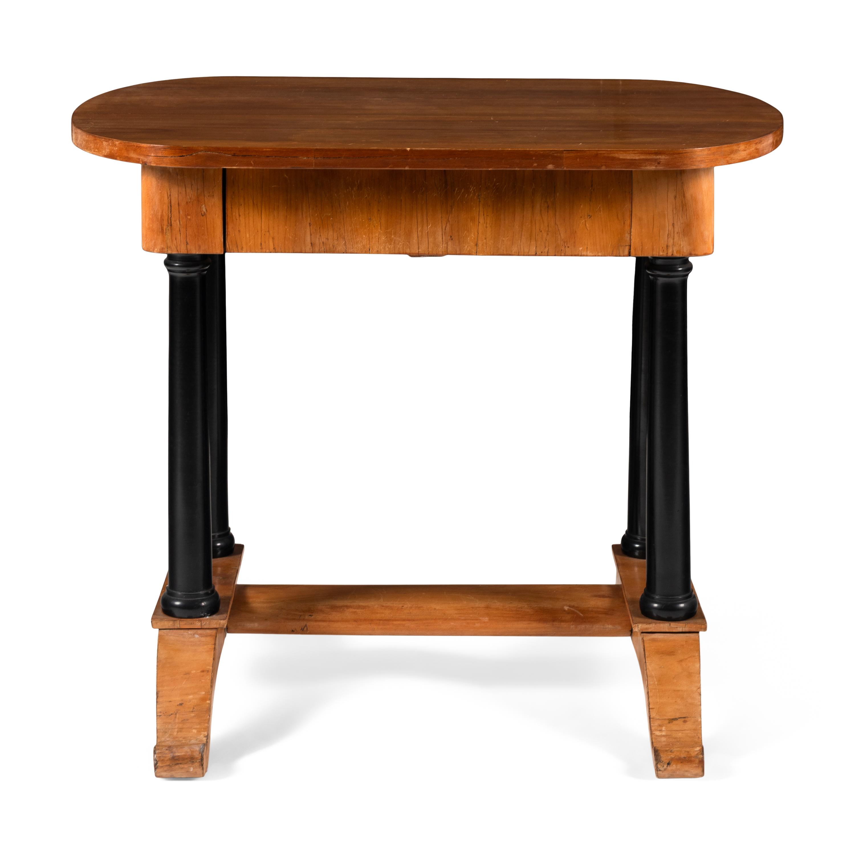 A Biedermeier Fruitwood and Part Ebonized Writing Table