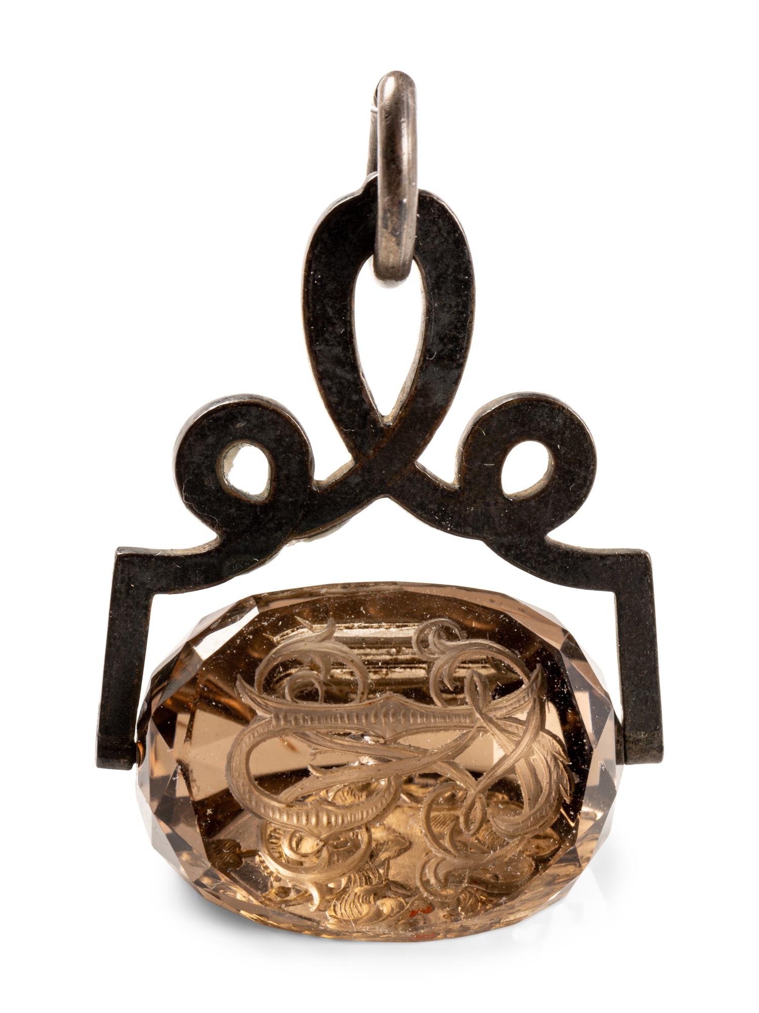 A German Carved Topaz and Gilt Metal Mounted Hand Seal