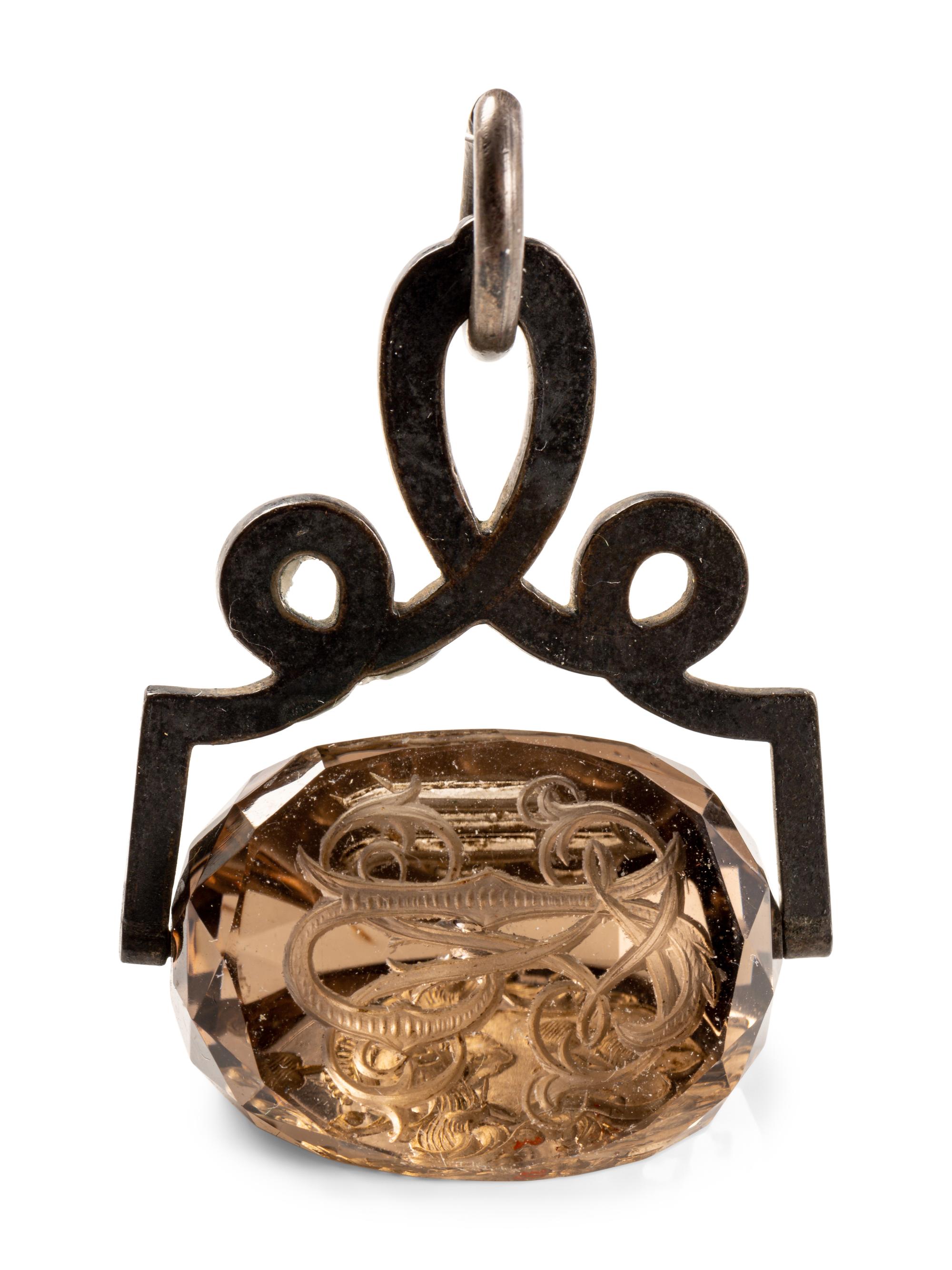 A German Carved Topaz and Gilt Metal Mounted Hand Seal