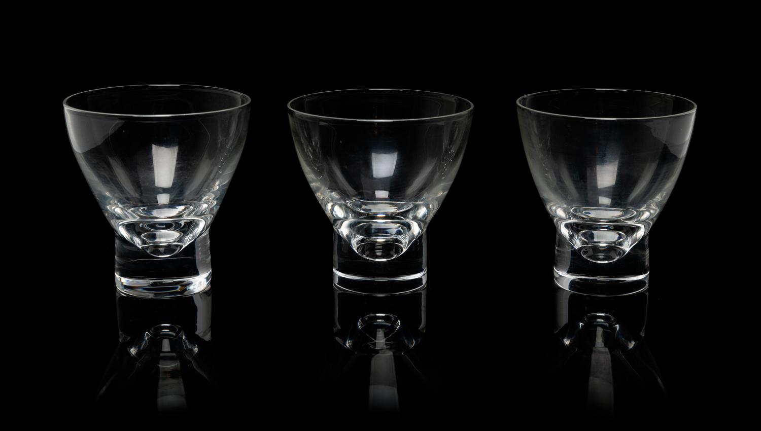 A Set of Twelve Steuben Footed Glass Tumblers Height 3 3/4 inches.