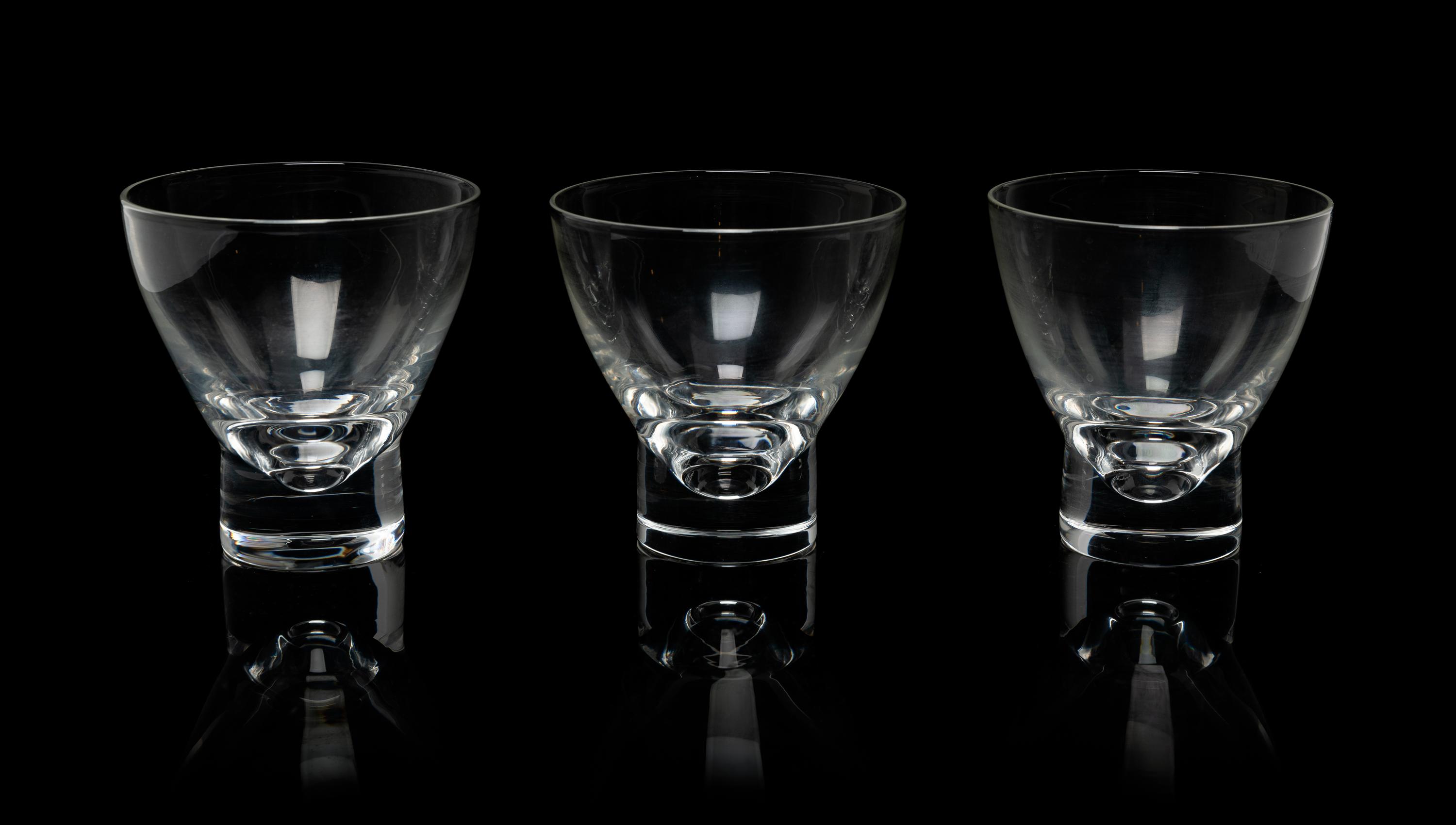A Set of Twelve Steuben Footed Glass Tumblers Height 3 3/4 inches.