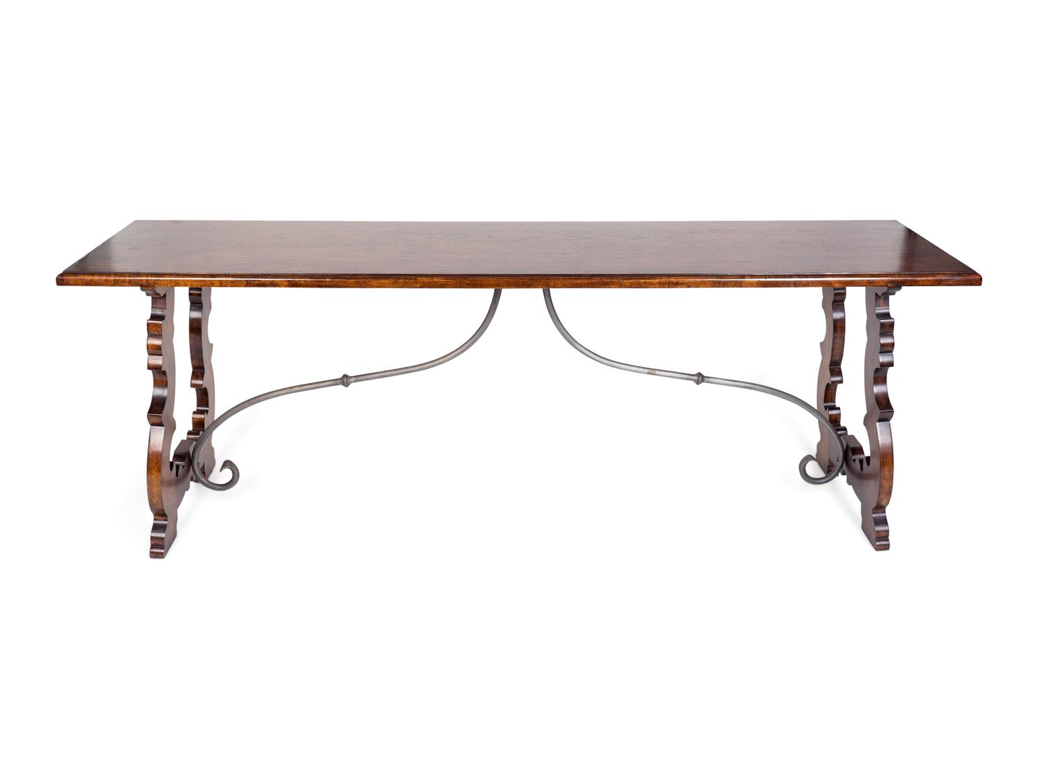 An Italian Baroque Style Mahogany Trestle Table