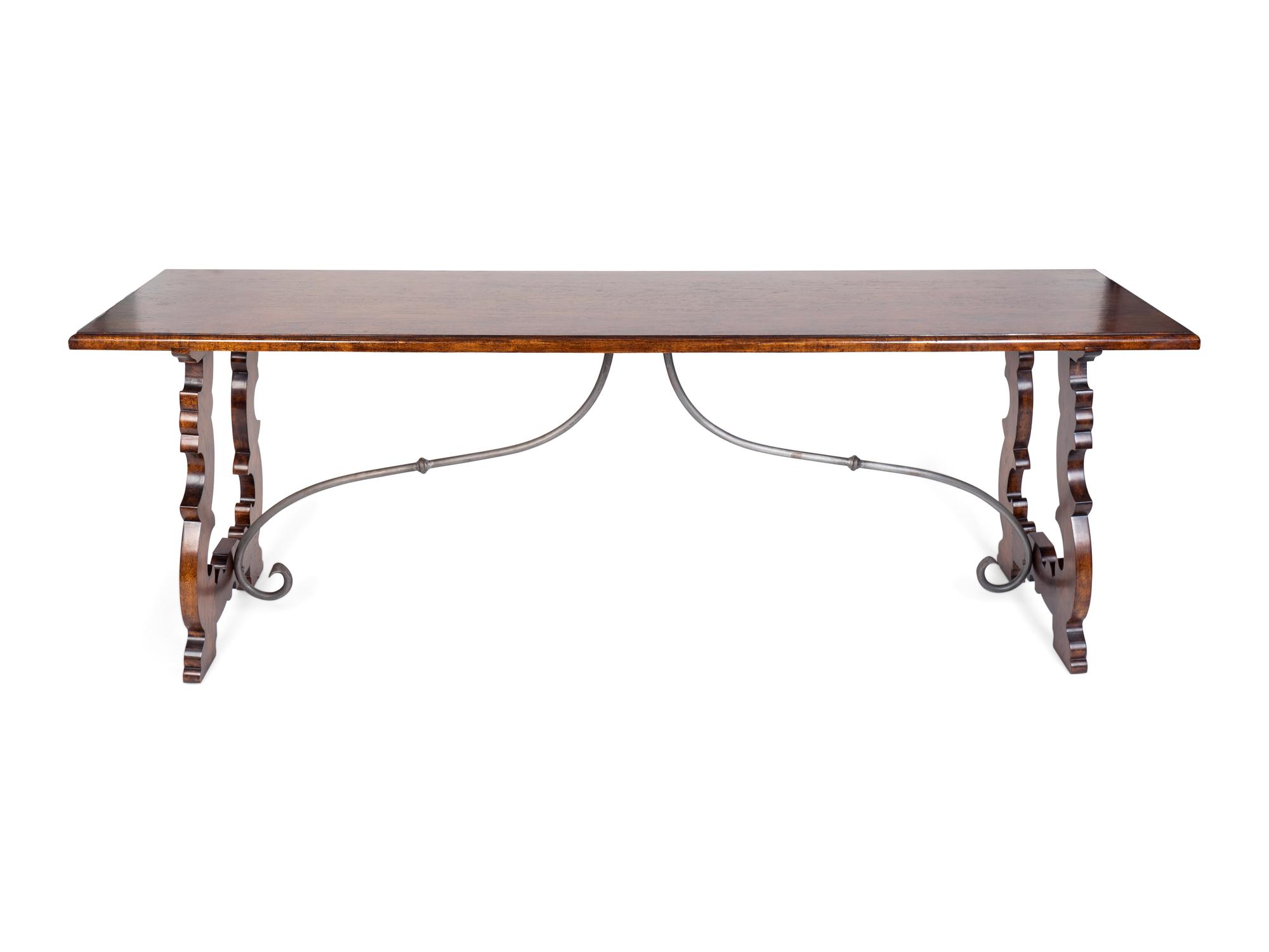 An Italian Baroque Style Mahogany Trestle Table