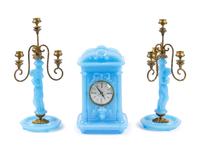 A Continental Blue Opaline Glass Three-Piece Clock Garniture