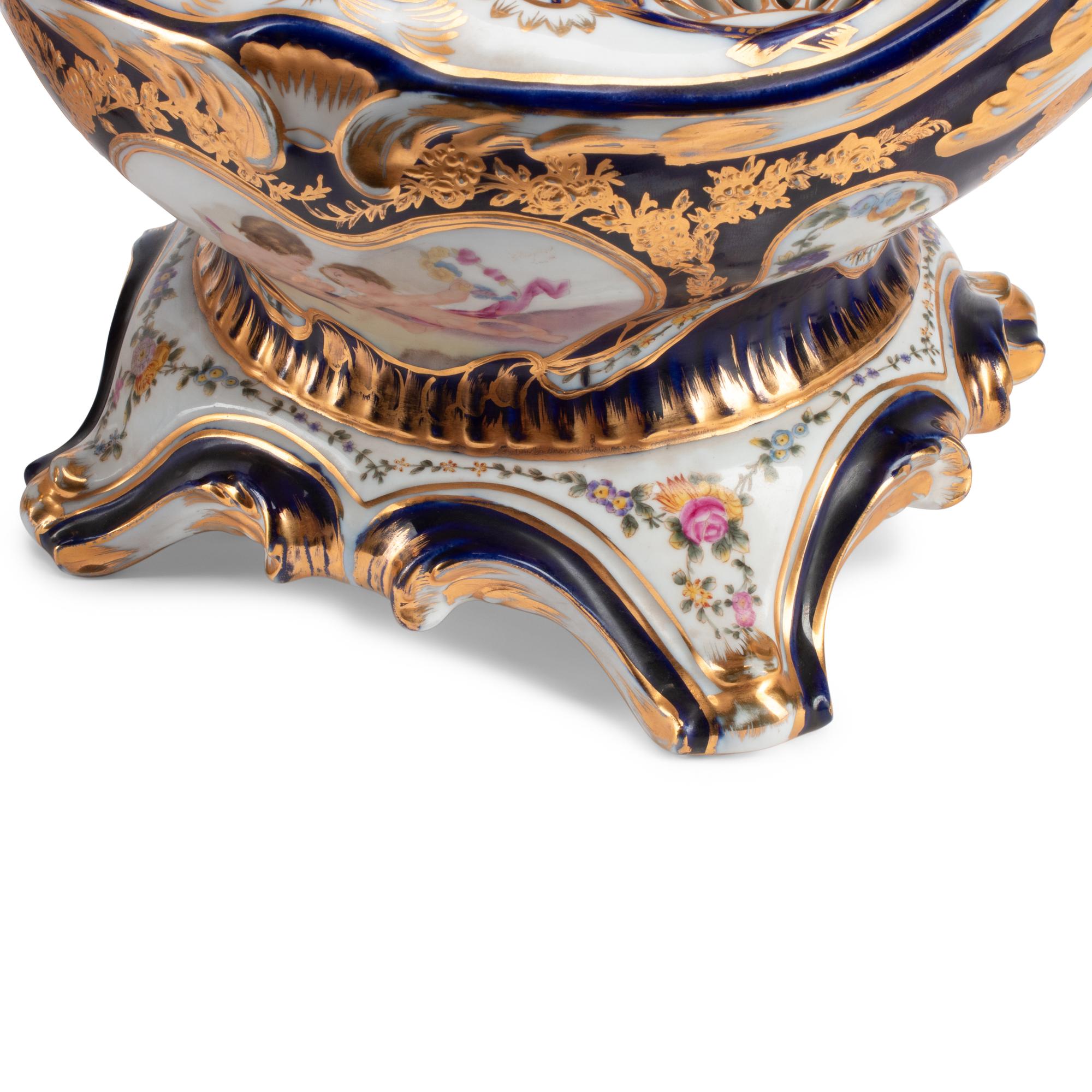 A Pair of Sèvres Style Porcelain Potpourri Vases and Covers