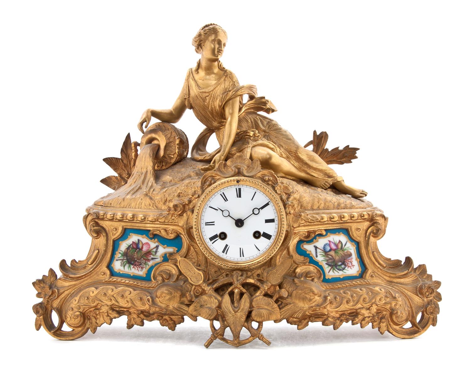 A Gilt Bronze and Sevres Style Porcelain Mounted Figural Mantel Clock, Height 13 1/2 x width 19 inches.