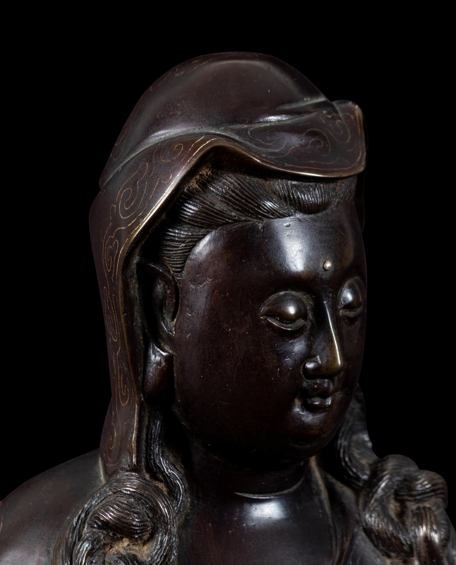 A Silver Inlaid Bronze Figure of Guanyin