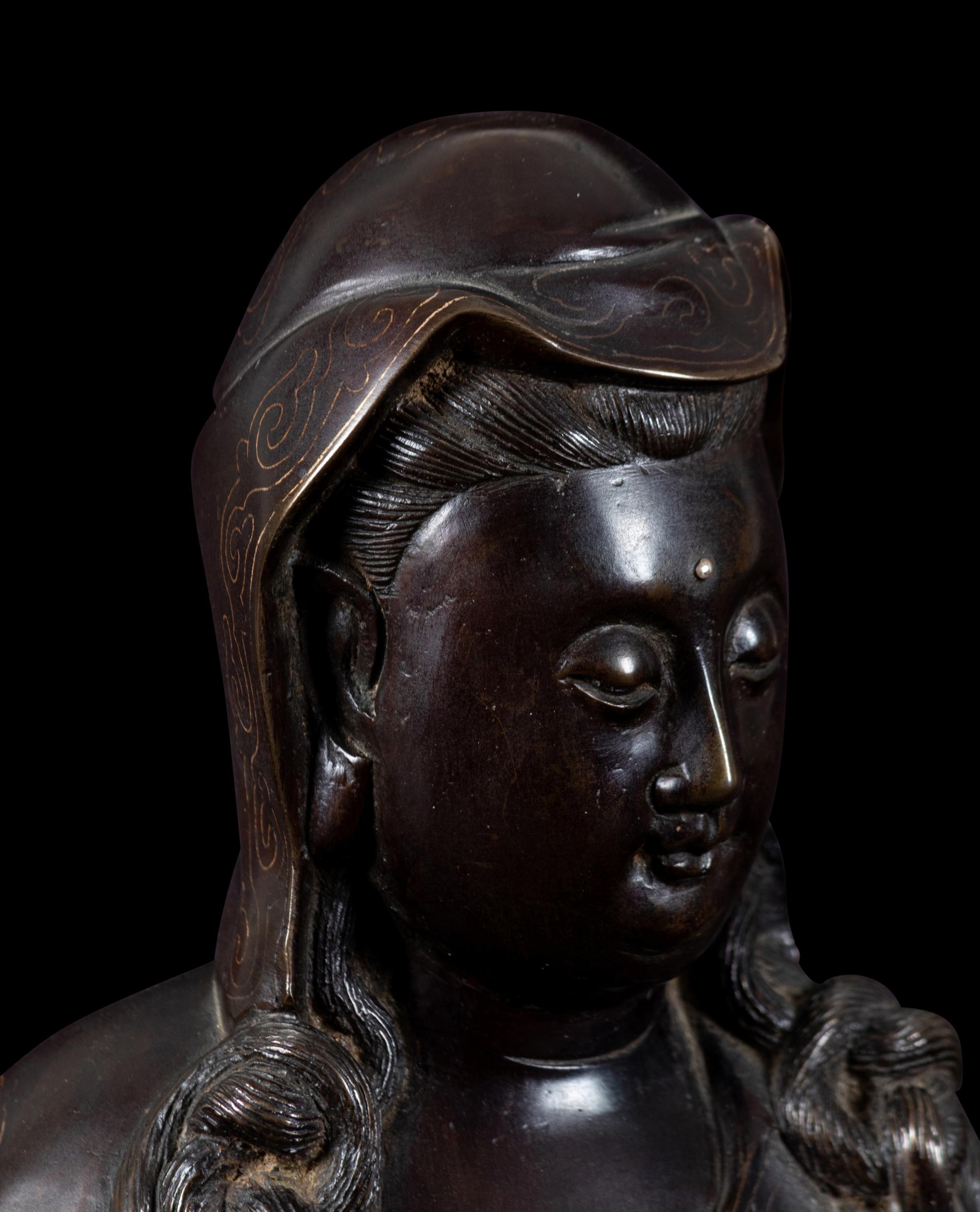 A Silver Inlaid Bronze Figure of Guanyin