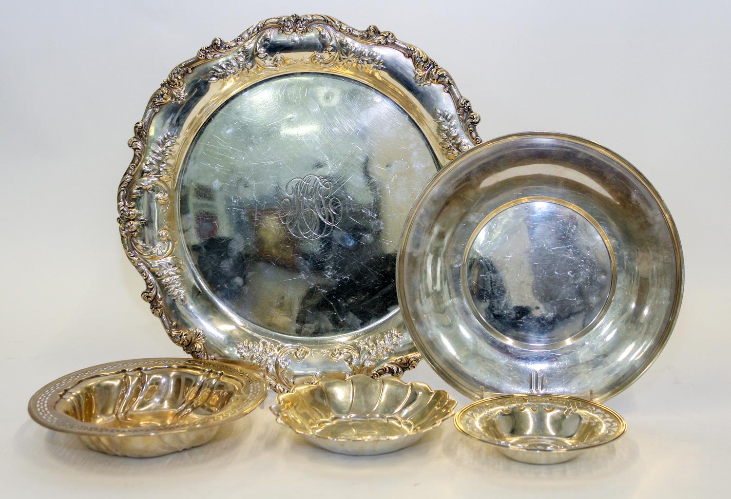 Five Silver Serving Articles, Various Makers, 20th Century, comprising a tray, a charger, two reticulated bowls and lobed dish.