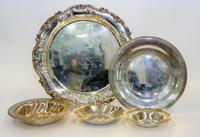 Five Silver Serving Articles, Various Makers, 20th Century, comprising a tray, a charger, two reticulated bowls and lobed dish.