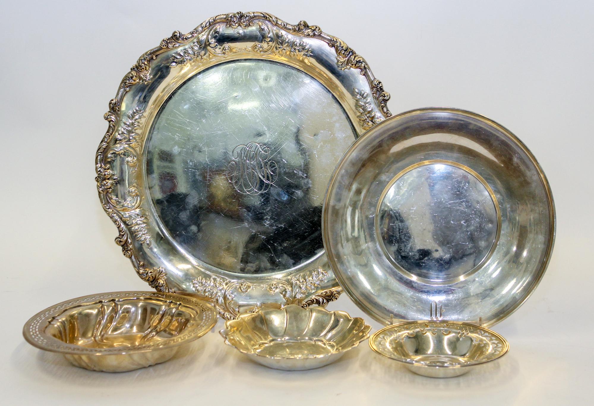 Five Silver Serving Articles, Various Makers, 20th Century, comprising a tray, a charger, two reticulated bowls and lobed dish.