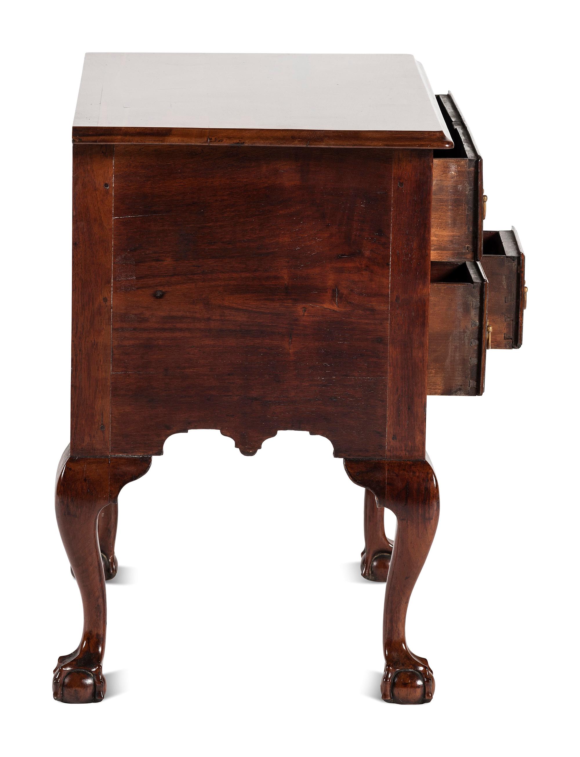 A Chippendale Carved and Figured Walnut Claw-and-Ball Foot Dressing Table