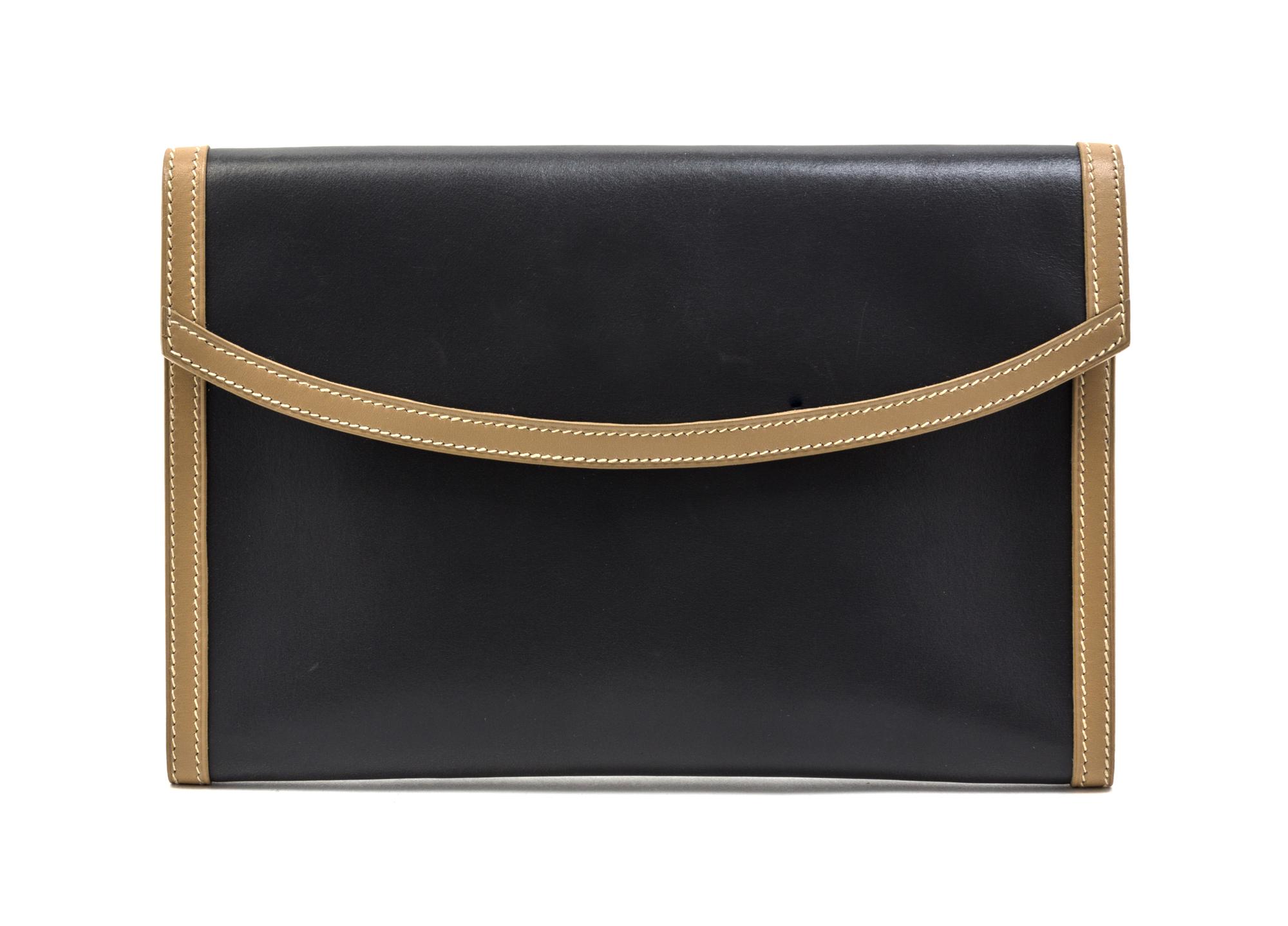 An Hermes Graphite and Taupe Leather Clutch, 9 1/2 x 6 1/2 x 1 inches.