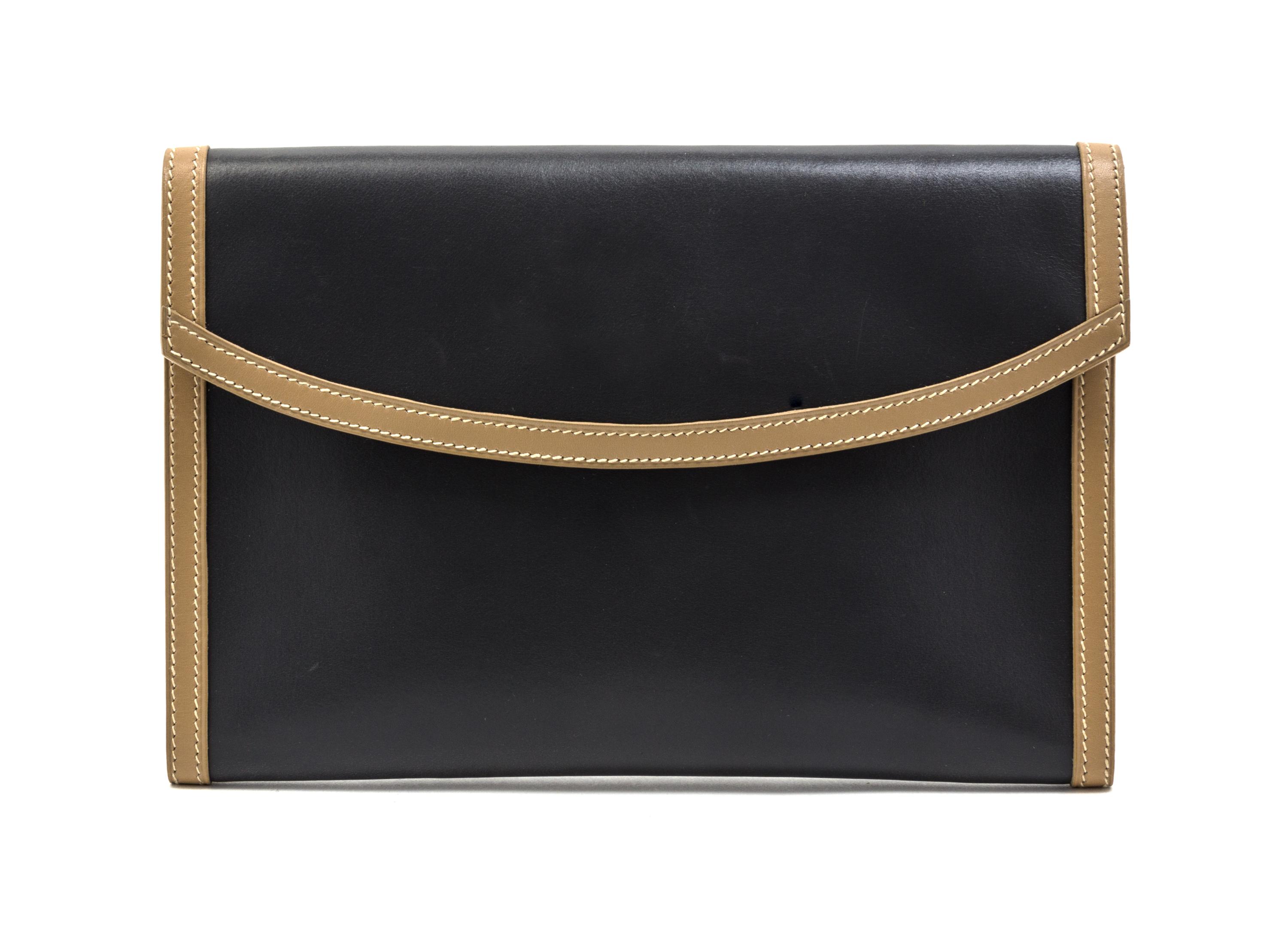 An Hermes Graphite and Taupe Leather Clutch, 9 1/2 x 6 1/2 x 1 inches.