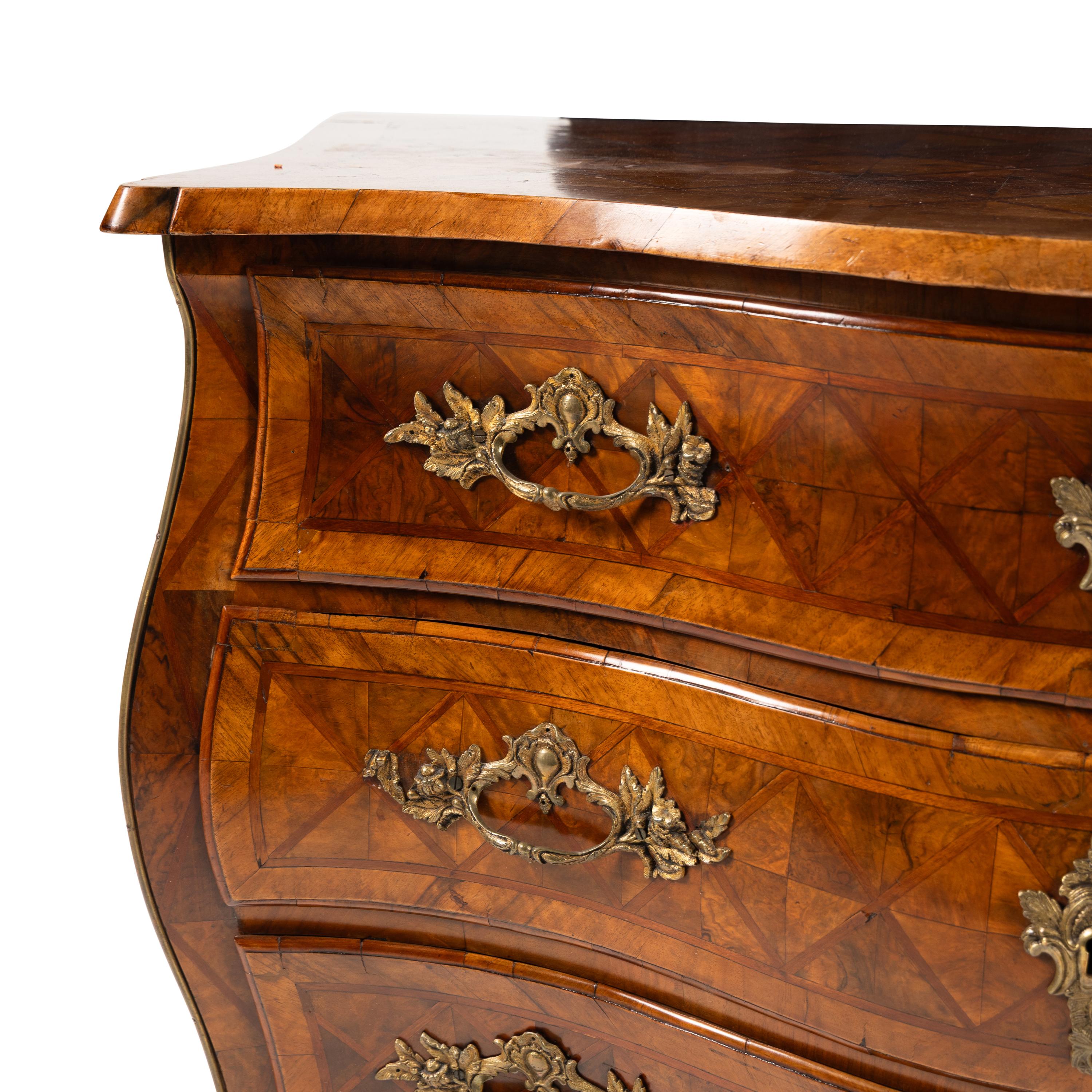 An Italian Gilt Bronze Mounted Walnut and Parquetry Commode