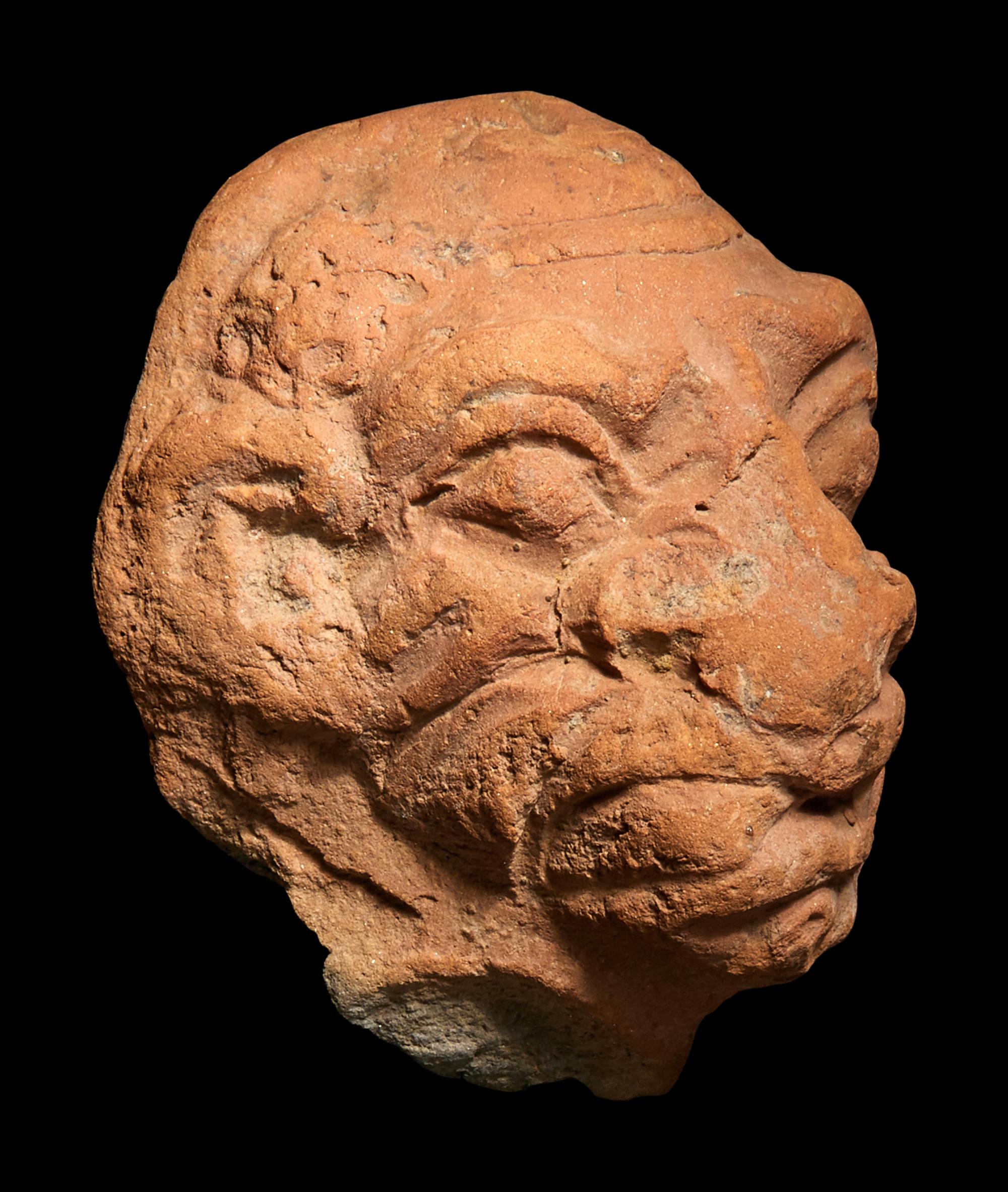 A Roman Terracotta Grotesque Head