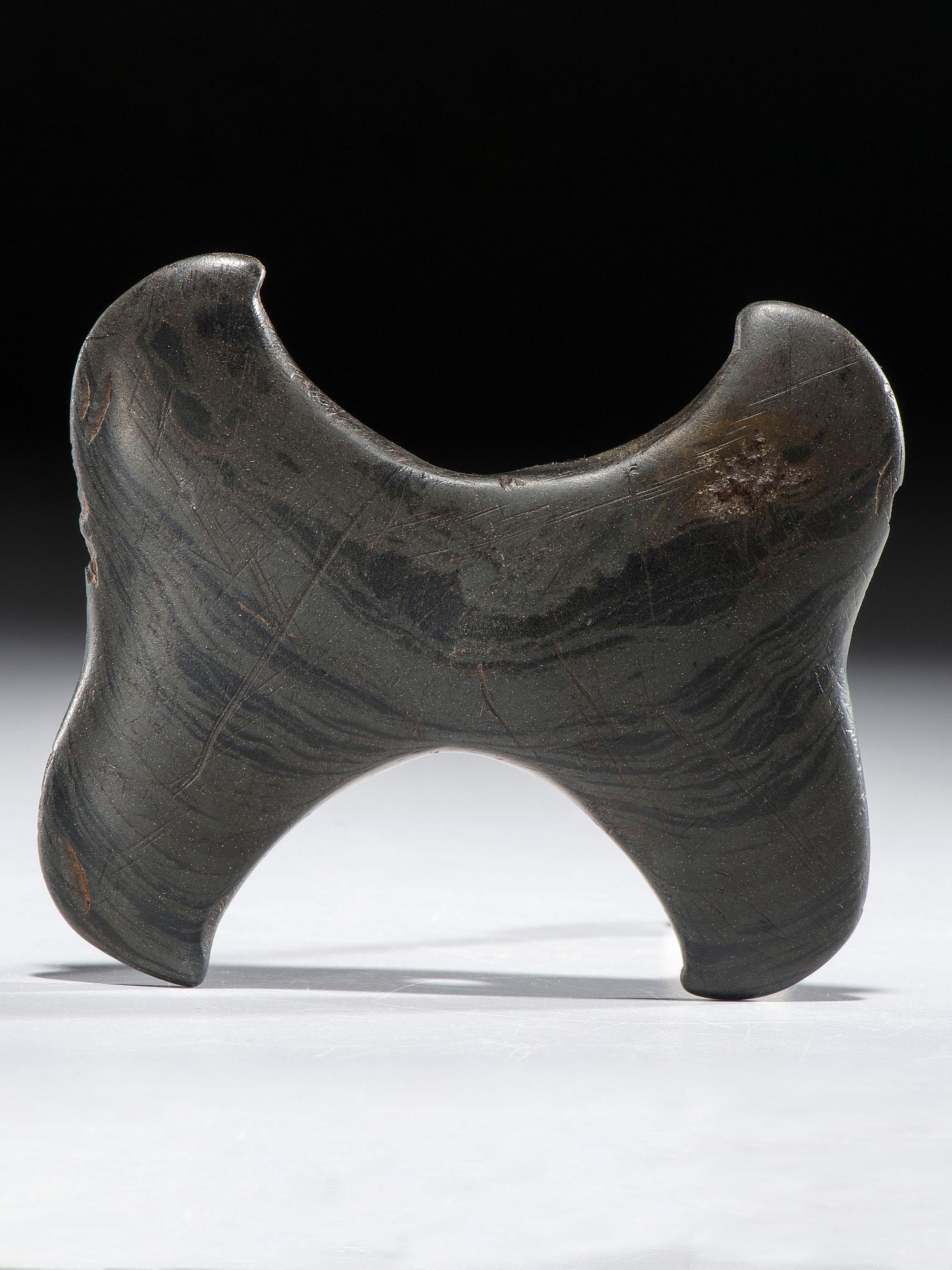 A Banded Slate Double Crescent Bannerstone