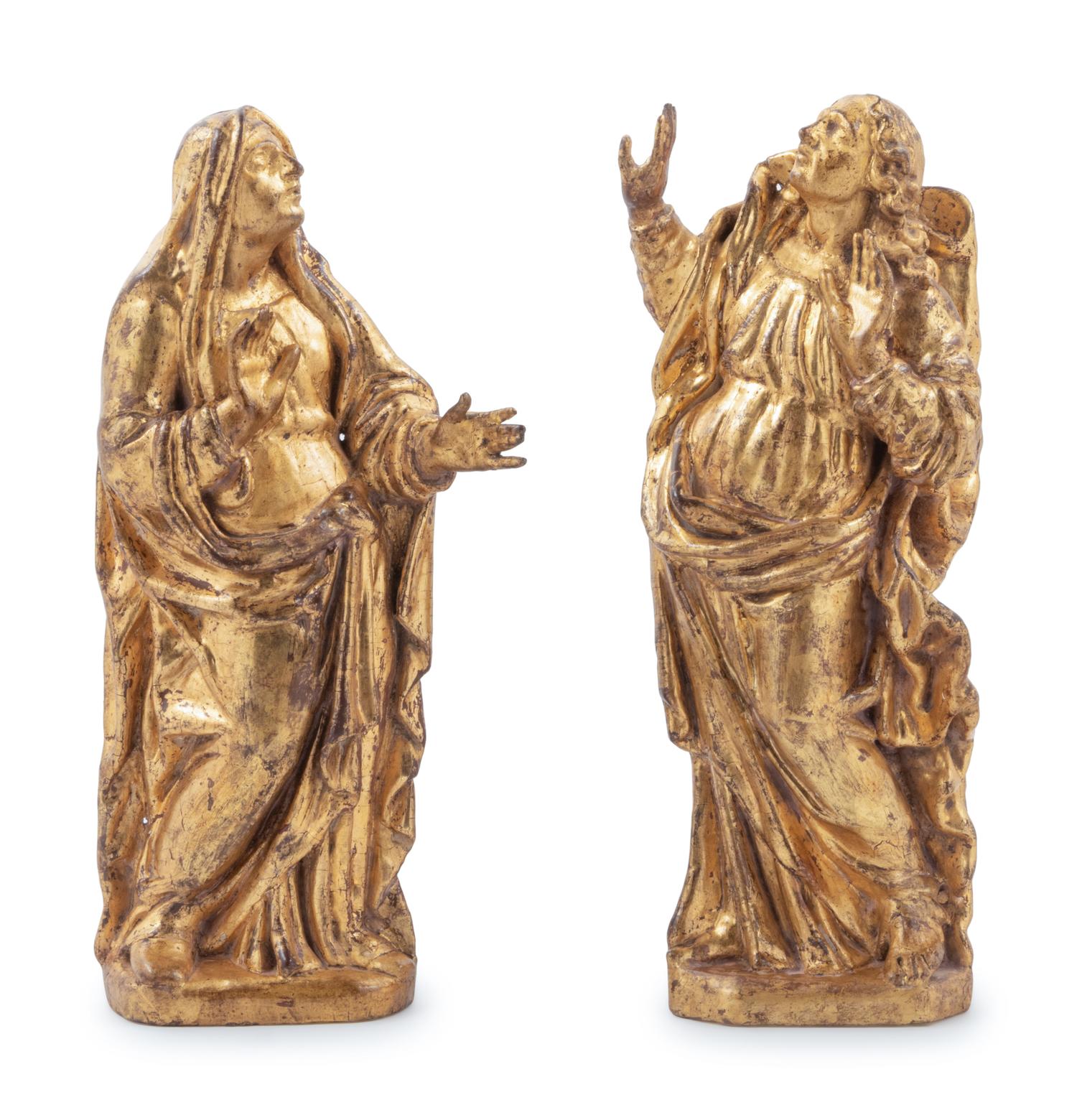 A Pair of Continental Giltwood Relief Carved Figures