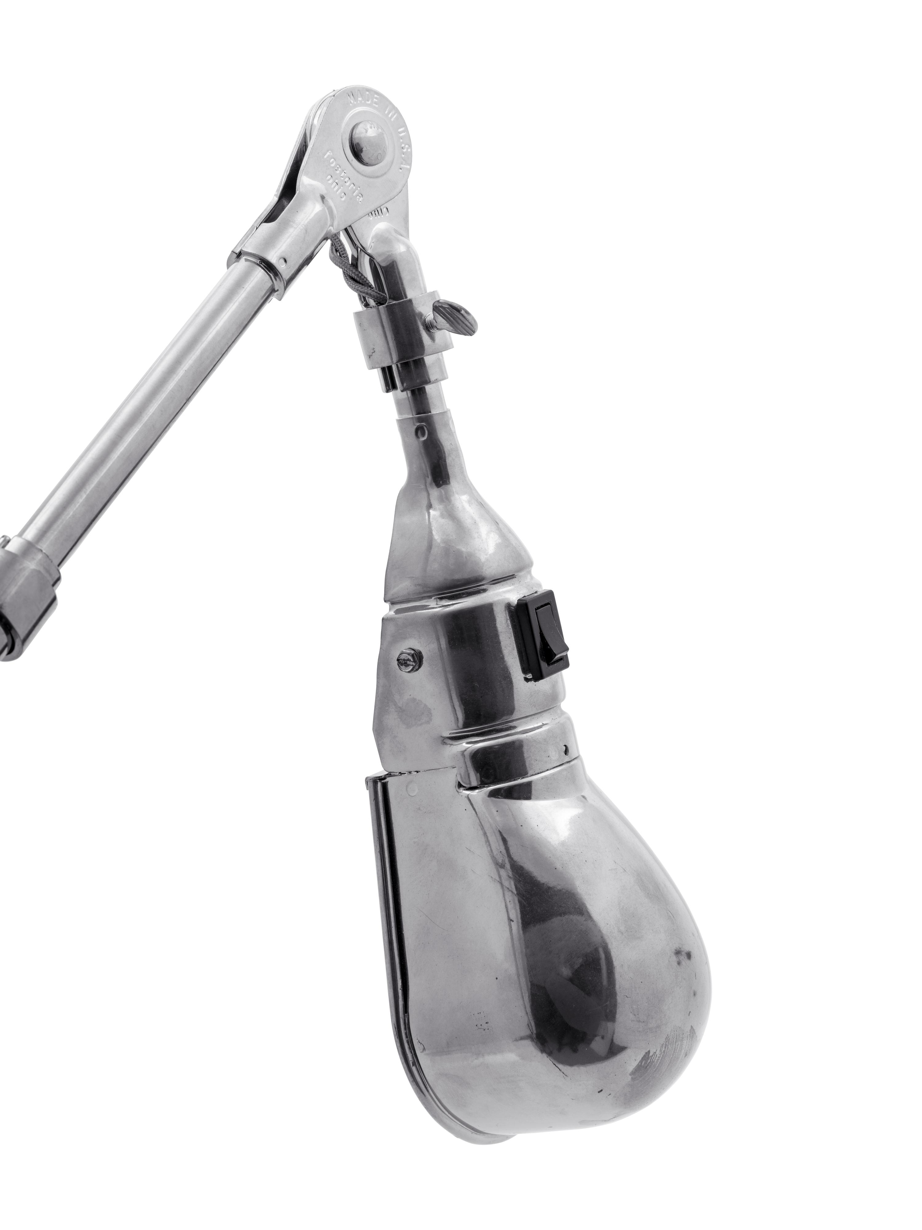 A Chromed Metal Articulated Table Lamp