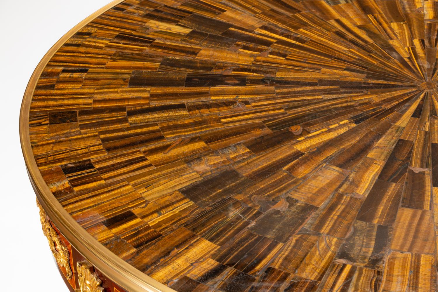 A Louis XV Style Gilt Bronze Mounted Parquetry Center Table with a Tiger's Eye Top