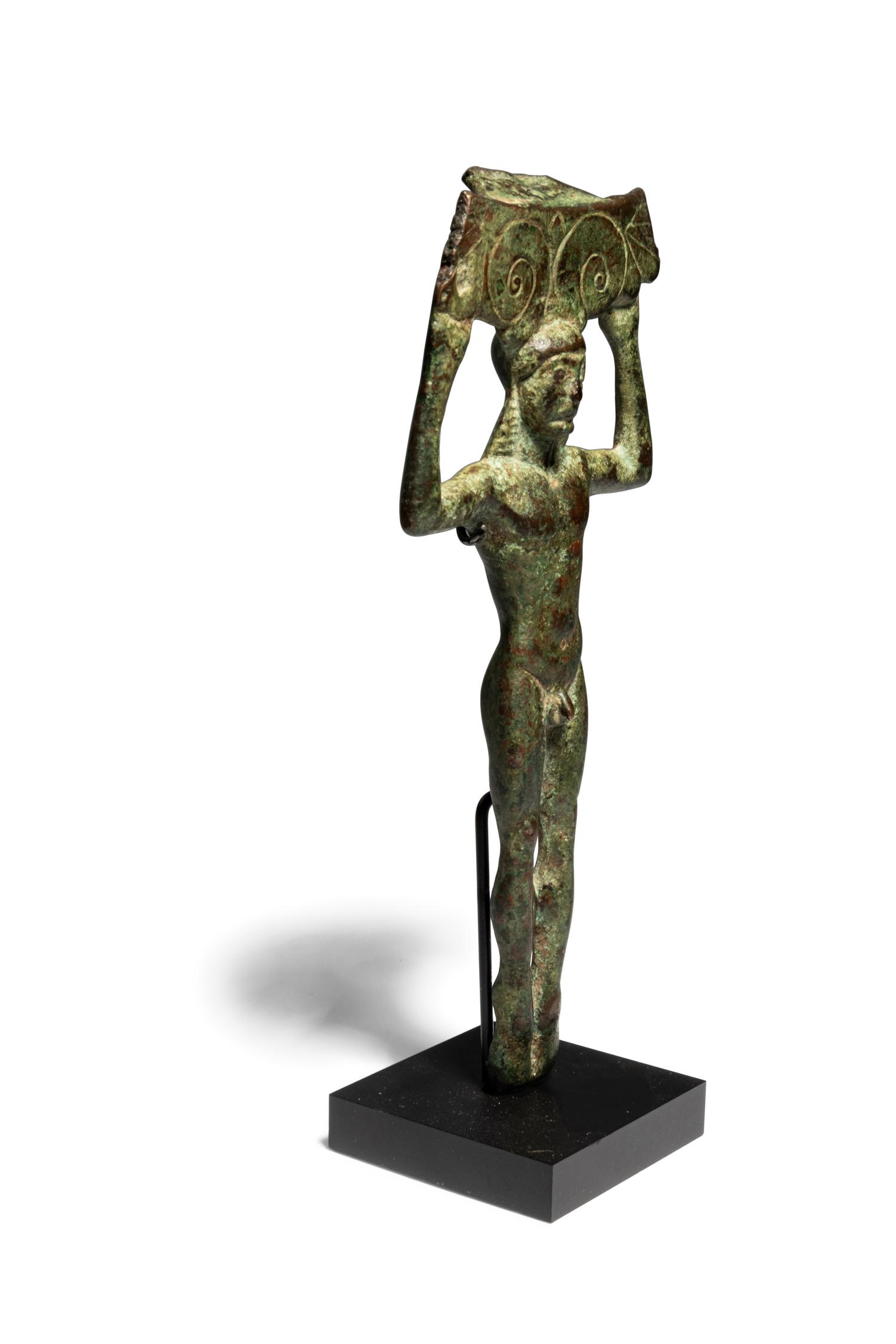 A Greek Bronze Patera Handle, in the shape of a Kouros