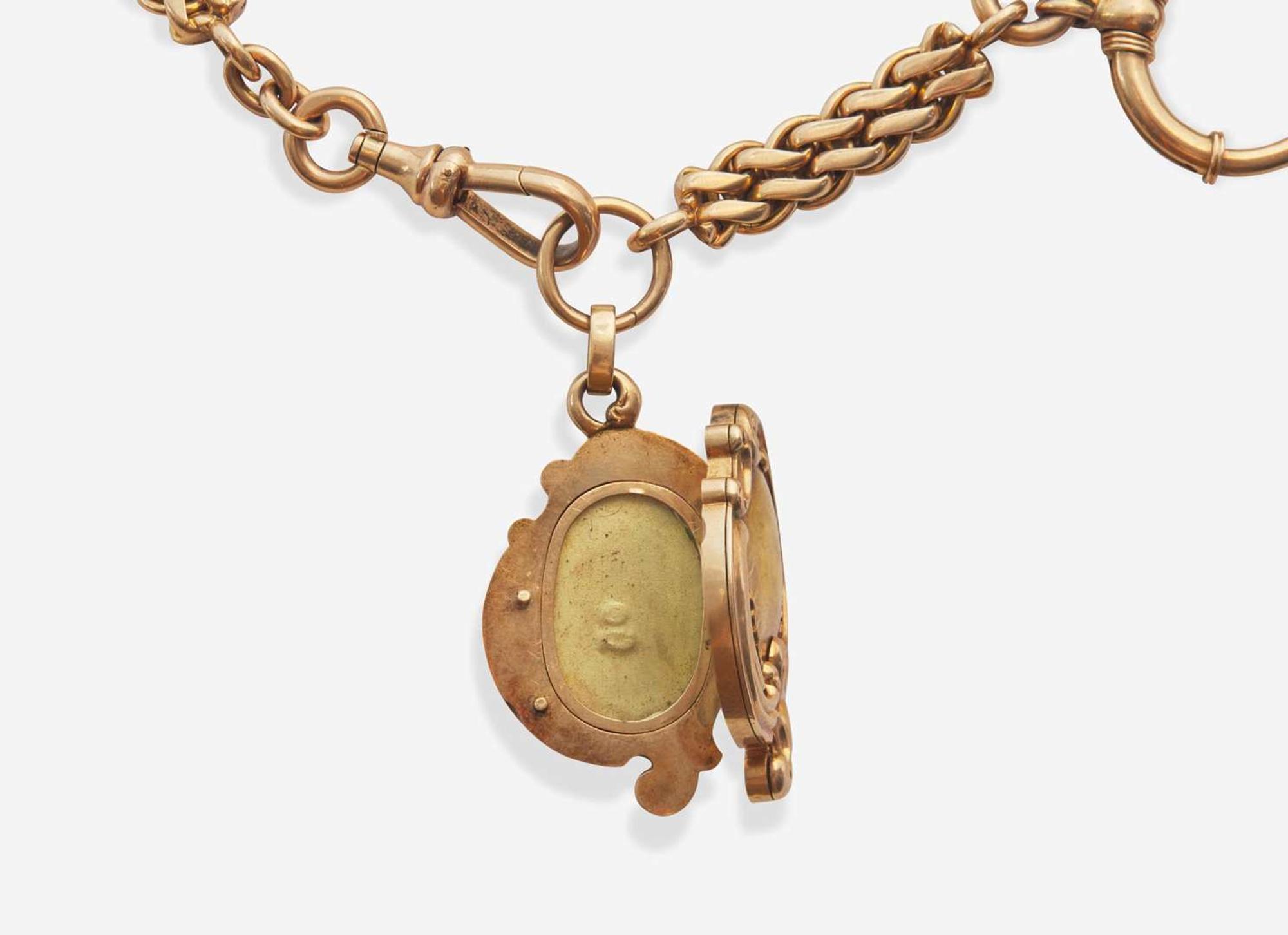 A 14K Yellow Gold Russian Pocket Watch Chain and Locket