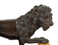 A Pair of Continental Patinated and Gilt Bronze Medici Lions