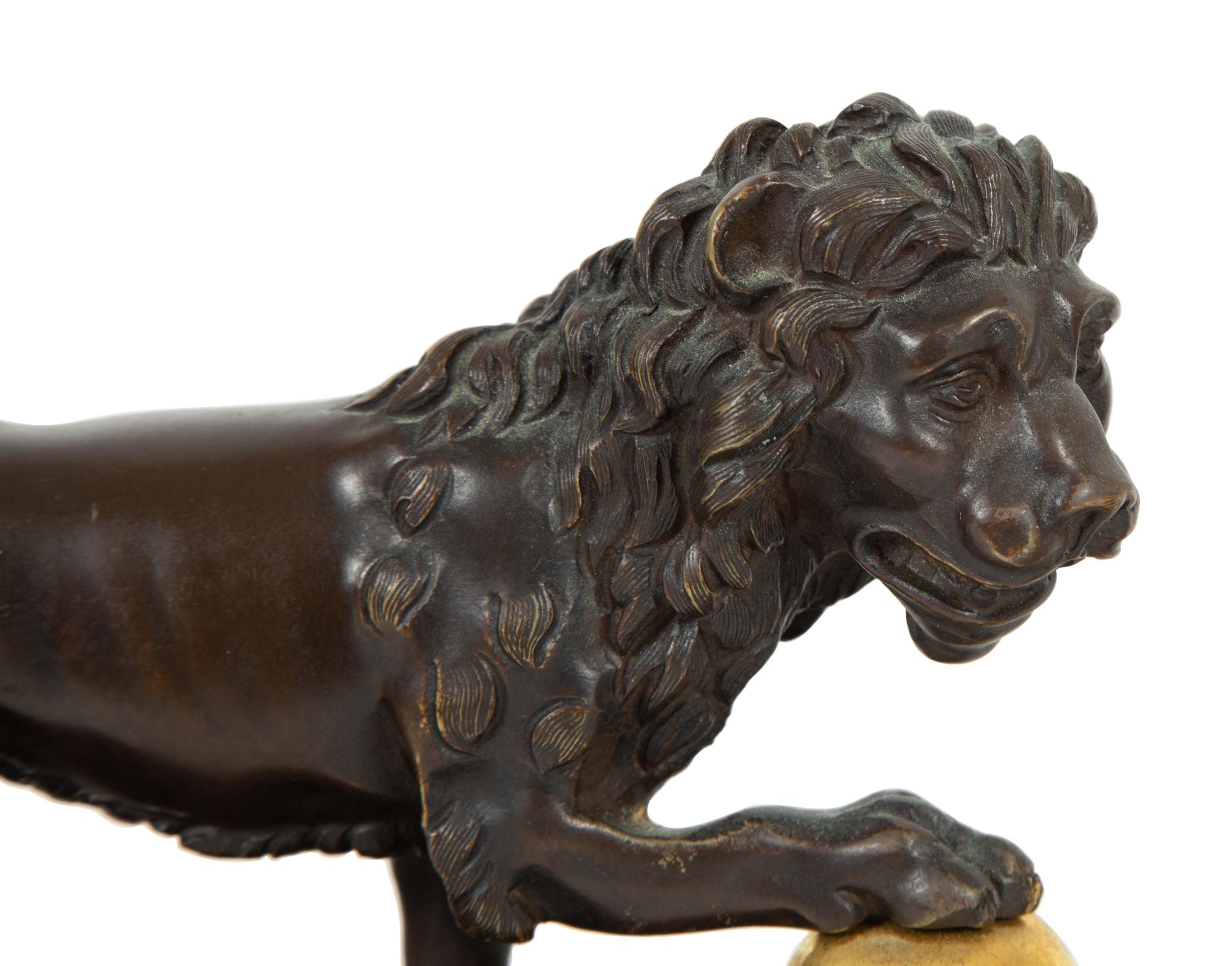 A Pair of Continental Patinated and Gilt Bronze Medici Lions