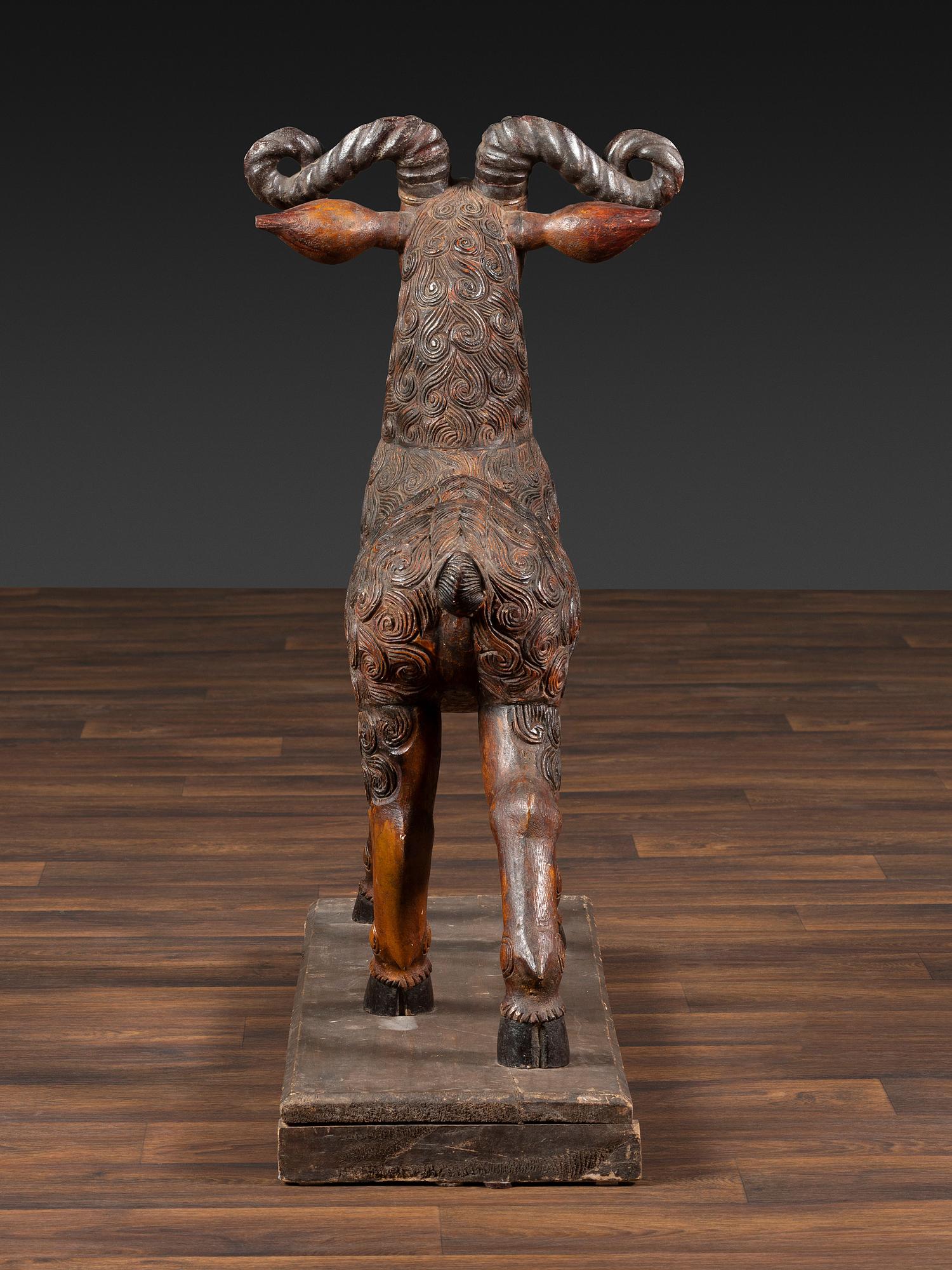A Folk Art Carved and Painted Wood Ram