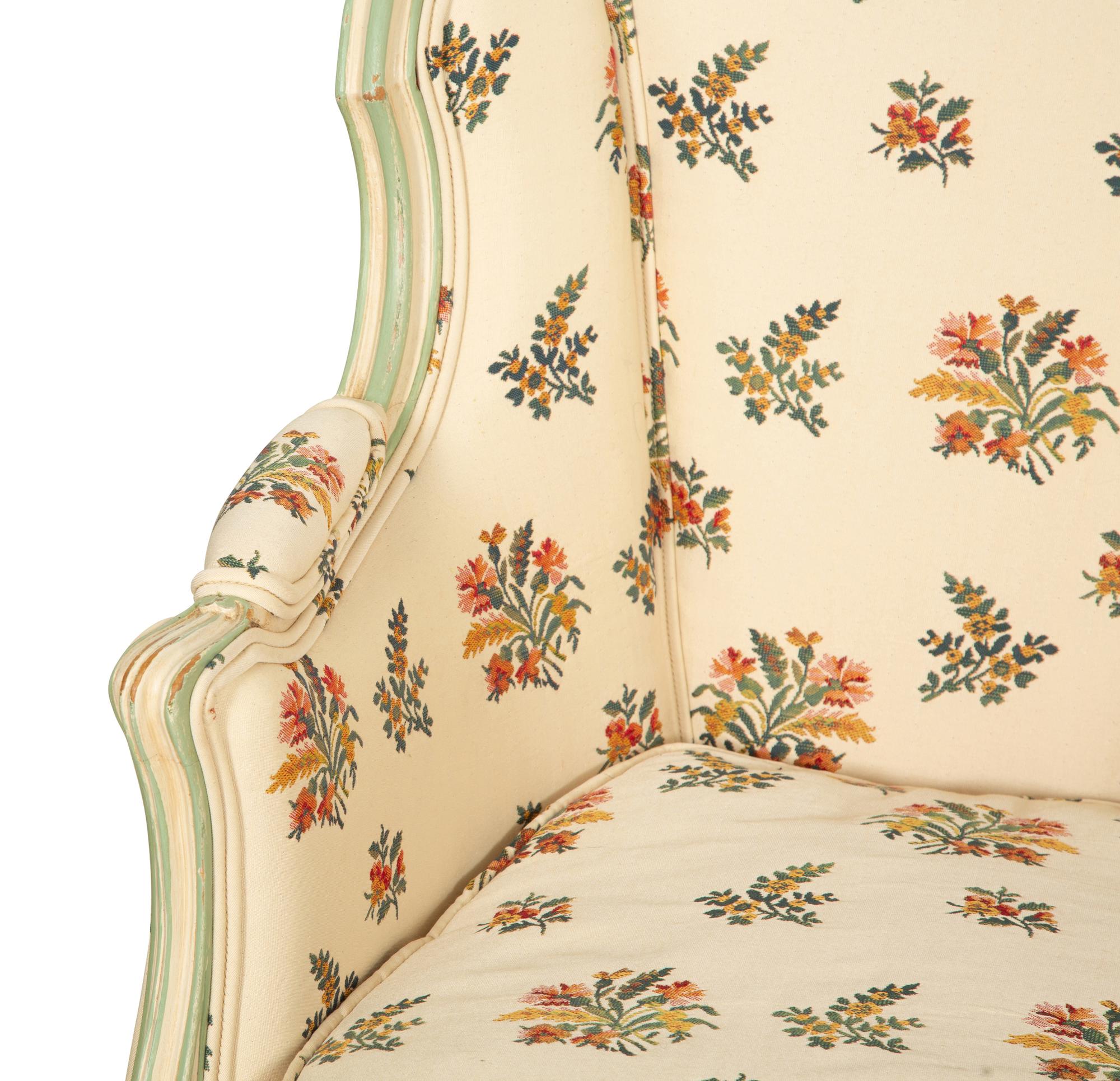 A Pair of Louis XV Style Painted Wingback Bergères and an Associated Stool