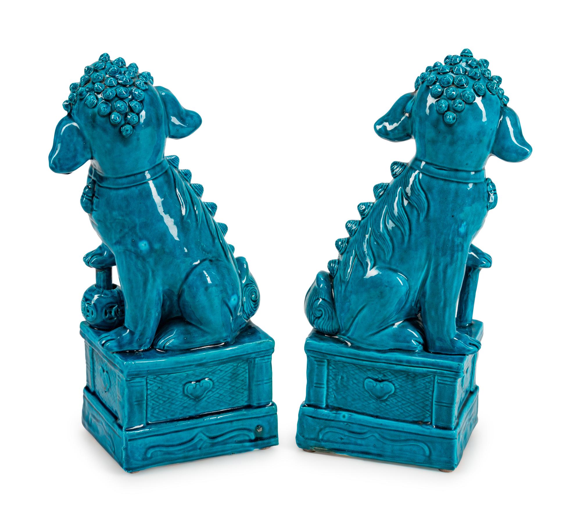 A Pair of Chinese Turquoise-Glazed Pottery Figures of Fu-Lions