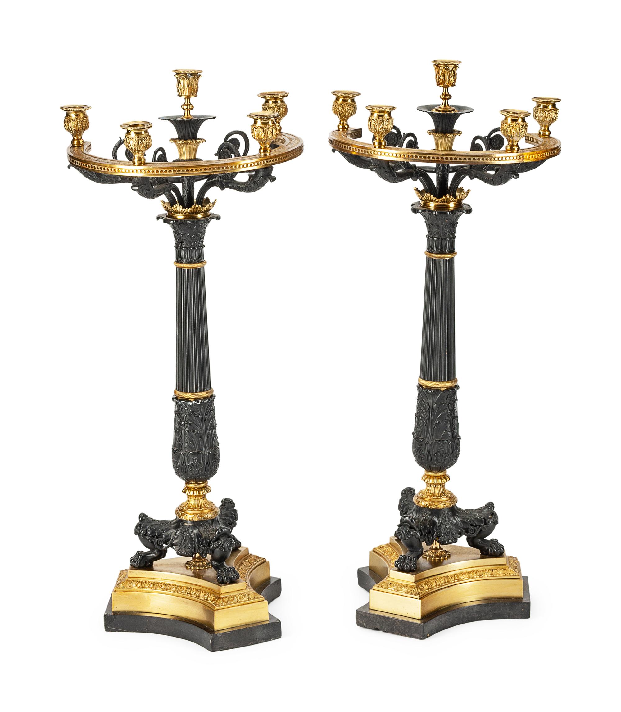 A Pair of Empire Style Parcel-Gilt and Patinated Bronze Five-Light Candelabra