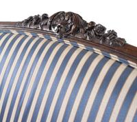 A Louis XV Style Carved Walnut Settee