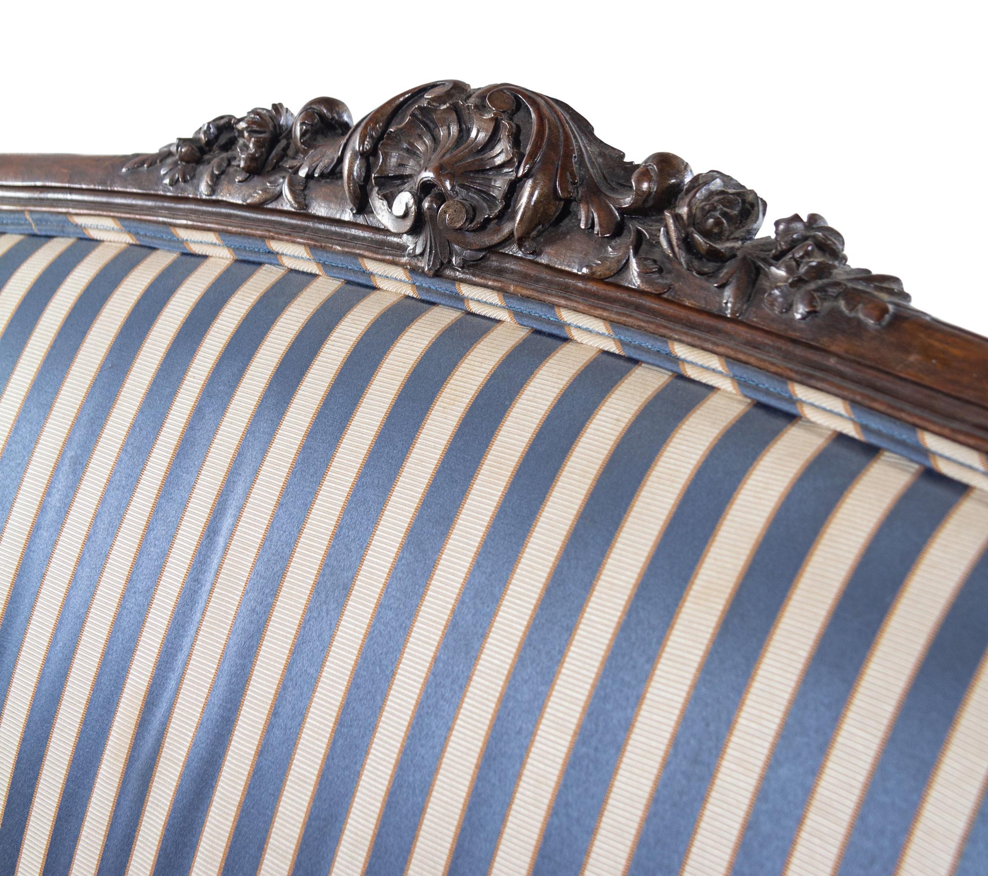 A Louis XV Style Carved Walnut Settee