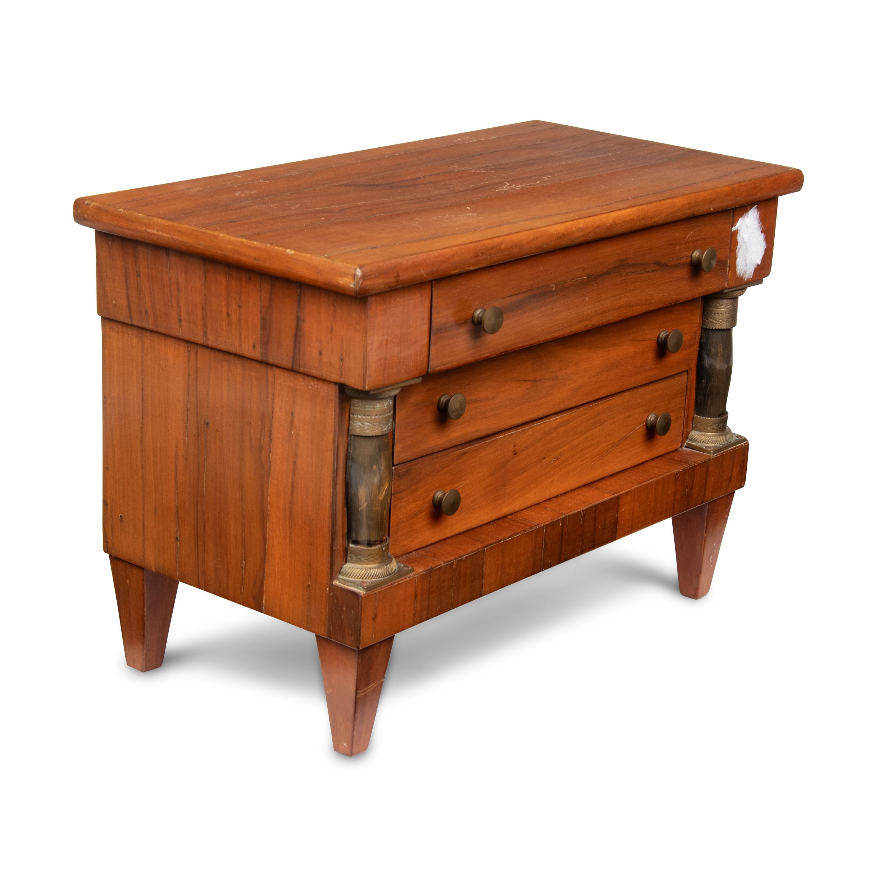 An Empire Style Diminutive Walnut Chest of Drawers