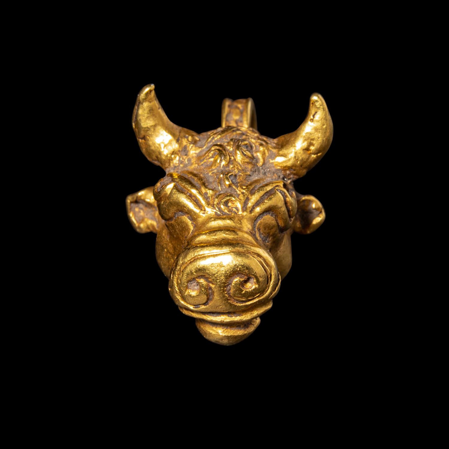A Roman Gold Bull Pendant
